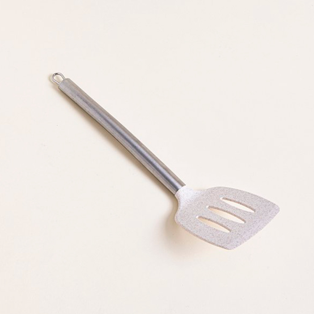 Espátula acanalada de plástico beige y mango de acero 34,5cm